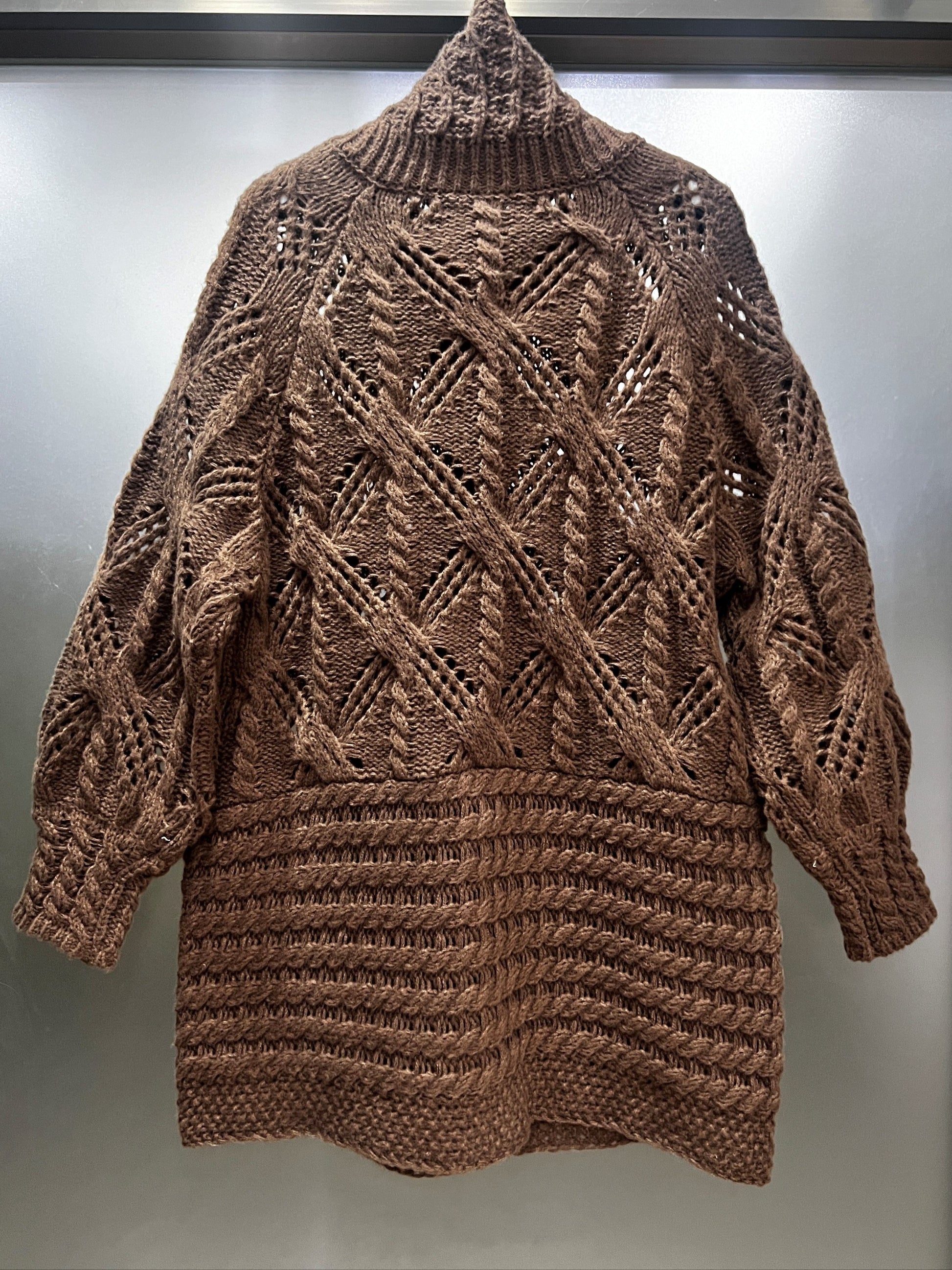 A Chunky Long Coat with a Twisted Rope Design