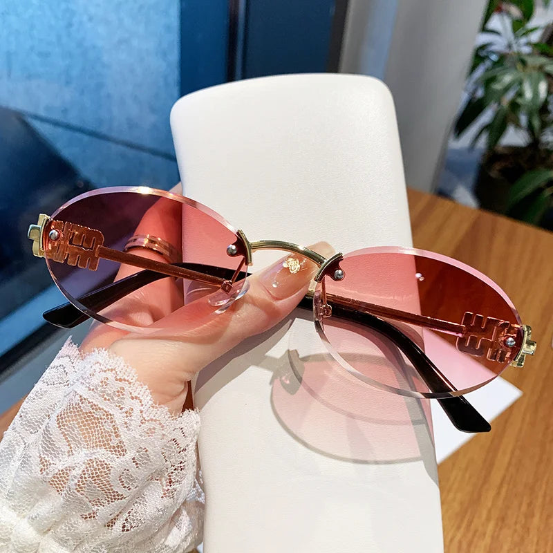 Oval Frame Sunglasses New Rimless Cut Edge Personality Glasses Fashion Design Sense Small Frame Sunglasses 90289