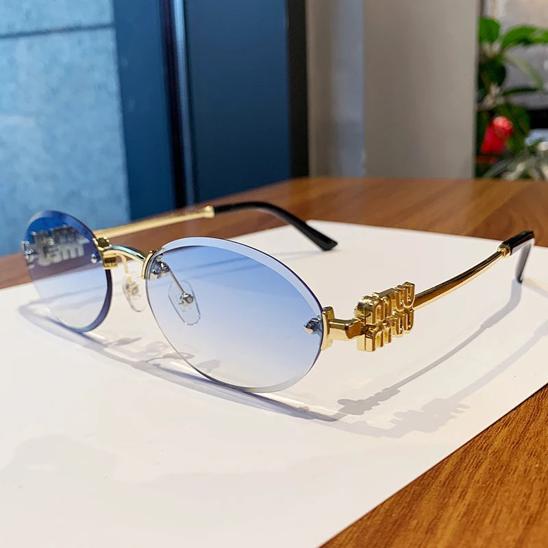 Oval Frame Sunglasses New Rimless Cut Edge Personality Glasses Fashion Design Sense Small Frame Sunglasses 90289