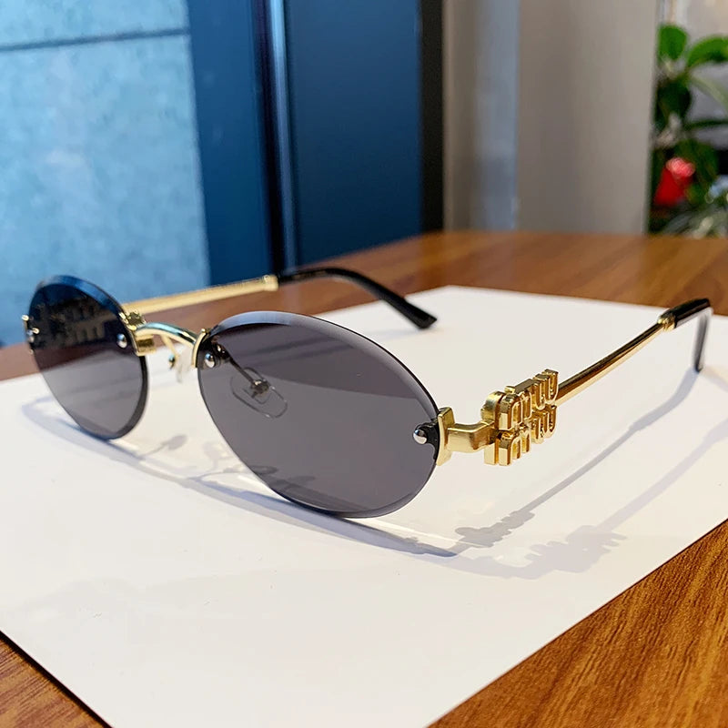 Oval Frame Sunglasses New Rimless Cut Edge Personality Glasses Fashion Design Sense Small Frame Sunglasses 90289